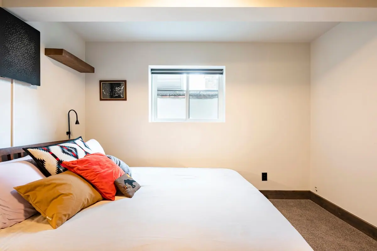 Garden-level bedroom — Evergreen Mountain House