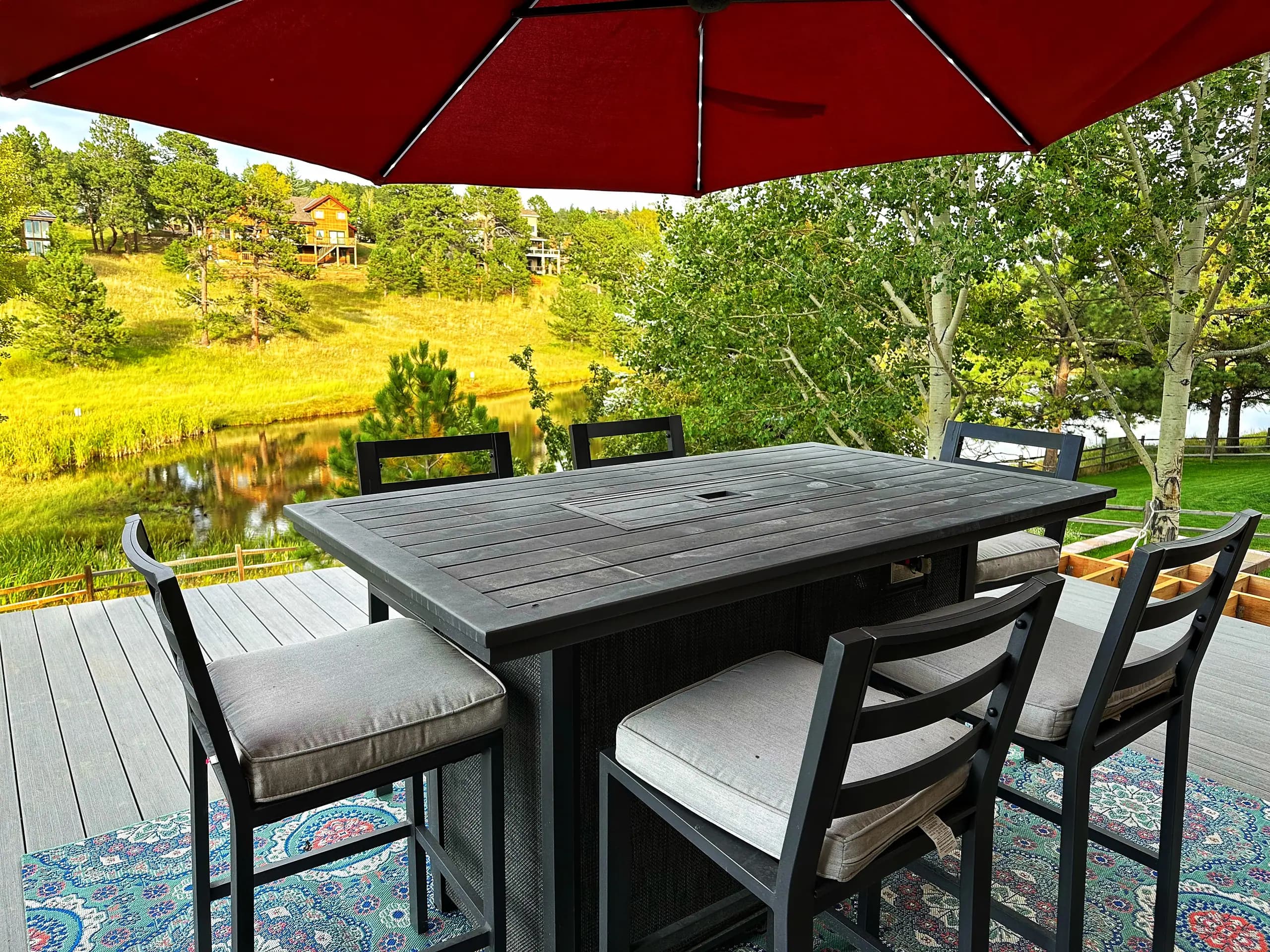 Patio dining with meadow views — Evergreen Mountain House