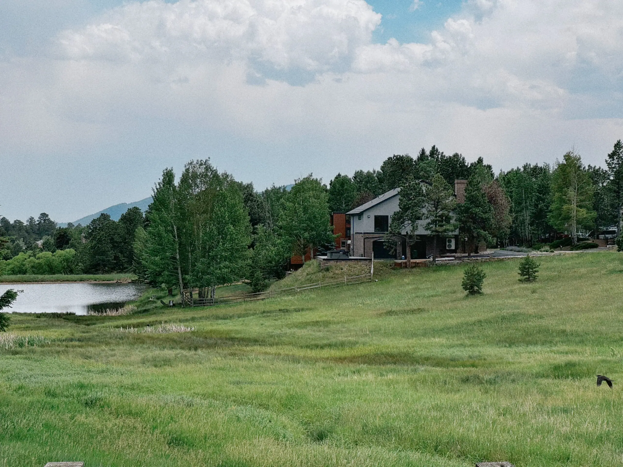 The house above the pond — Evergreen Mountain House